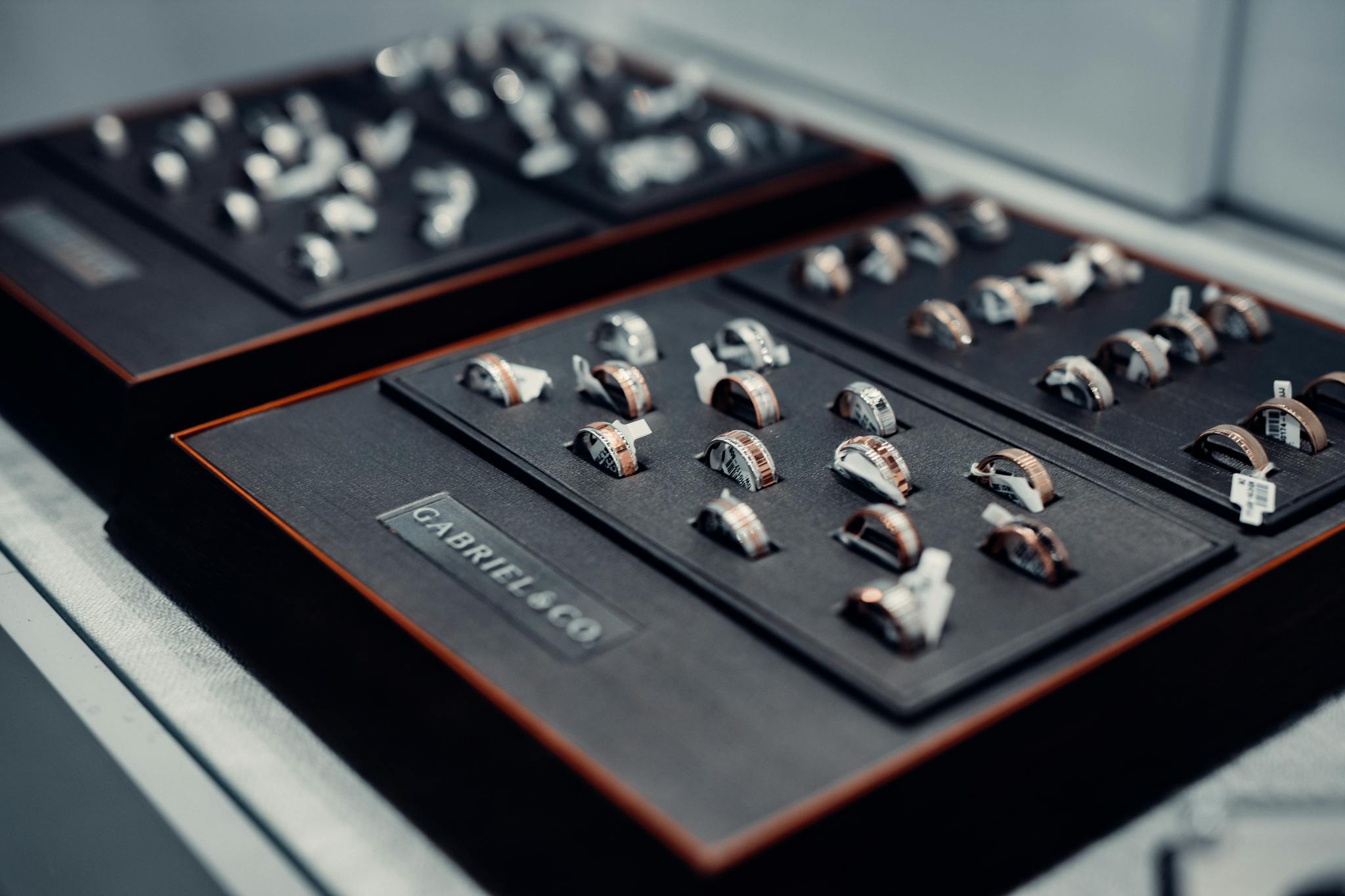A collection of luxurious rings elegantly displayed on velvet trays, showcasing fine craftsmanship and design.
