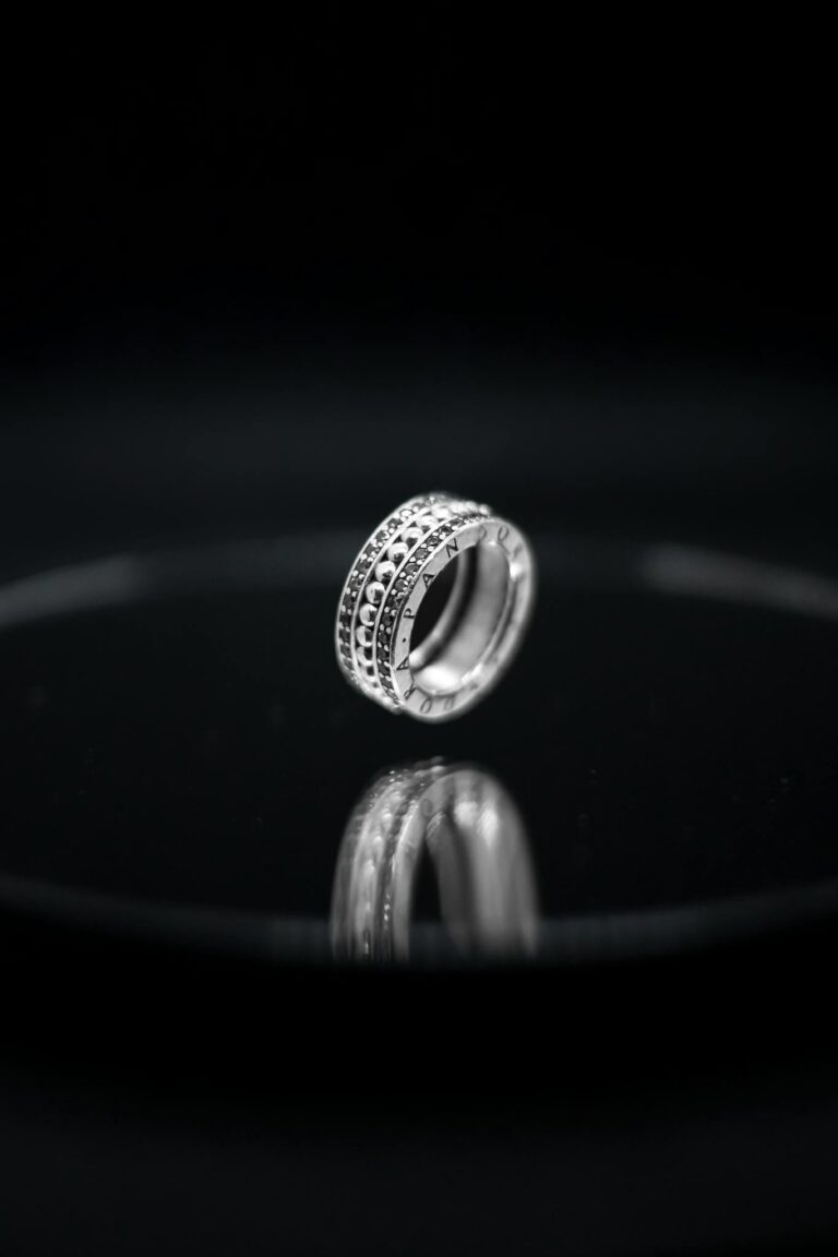 Stylish diamond ring with black background symbolizing elegance and luxury.